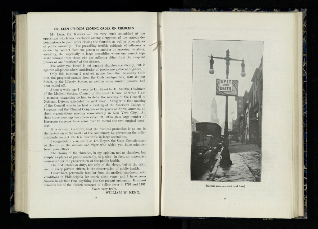 Anti-spitting sign posted on top of Fourth Liberty Loan sign